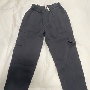 Size 0 The Group Babaton titan pants in GOLDEN BLACK from Aritzia